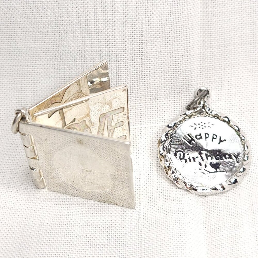 Two Silver Charms